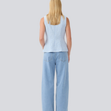 Tailored top without sleeves made from a structured material. HollisMD top has a high v-shaped neckline with a hidden zipper at the neck.