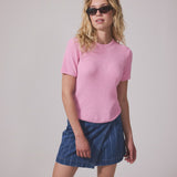 Denim short skirt in cotton denim. IsoldeMD jacquard skirt has an asymmetrical closure in front and is closed with a button.