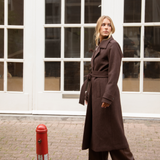 Brown classic, double-breasted wool coat with collar and notch lapels. ShayMD coat, in the color Dark Coffee, has a wide tiebelt at waist, shoulder straps, wide cuffs and open yoke. With lining and single back vent.&nbsp;
