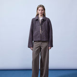 Short jacket in a wool mix. JustyMD short jacket has a loose fit, button closure and to pockets in front.