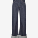 Indigo blue wide-leg jeans with a regular waist, five-pocket construction and oversized turn-up cuffs. Wear them with a fitted top or cropped shirt. The model is 175 cm tall and is wearing a size S/36.