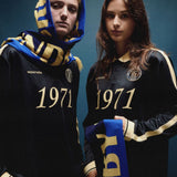 Football jersey made in collaboration with the Danish football team Brøndby Women. The 1971 Polo in navy with yellow details features a loose fit, with a placket closure and collar, as well as long sleeves that have ribbed cuffs. The polo features Brøndby Women and Modström logos on the chest.