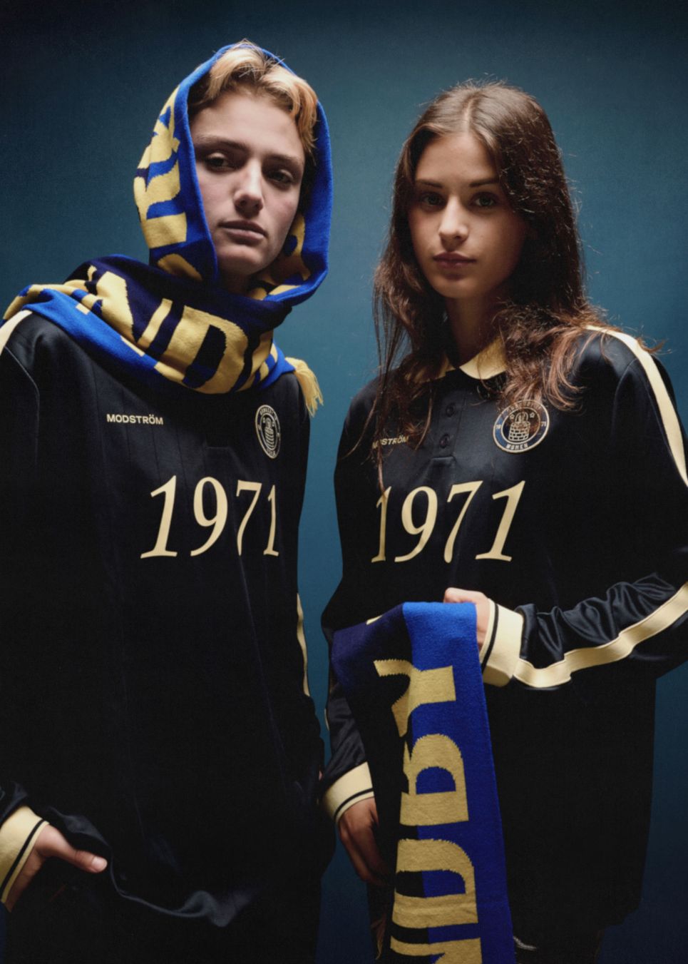 Football jersey made in collaboration with the Danish football team Brøndby Women. The 1971 Polo in navy with yellow details features a loose fit, with a placket closure and collar, as well as long sleeves that have ribbed cuffs. The polo features Brøndby Women and Modström logos on the chest.