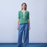 Short-sleeved polo in shimmery knit in the color Medium Green Stripe. Pacifico SS polo has a tight fit and a placket with 5 buttons. The model is 175 cm and wears a size s/36.