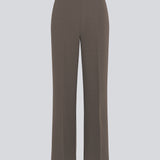Classic pants in brown with pressfolds and straight legs. Nelli pants are closed by an hidden zipper at the side with an elastic waistband for a more comfortable fit.&nbsp;