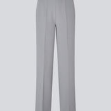 Classic pants in grey with pressfolds and straight legs. Nelli pants are closed by an hidden zipper at the side with an elastic waistband for a more comfortable fit.&nbsp;
