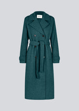 Classic, double-breasted wool coat with collar and notch lapels. ShayMD coat has a wide tiebelt at waist, shoulder straps, wide cuffs and open yoke. With lining and single back vent.