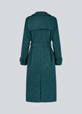 Classic, double-breasted wool coat with collar and notch lapels. ShayMD coat has a wide tiebelt at waist, shoulder straps, wide cuffs and open yoke. With lining and single back vent.