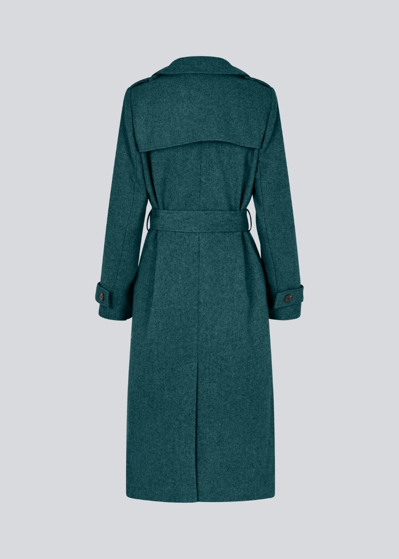 Classic, double-breasted wool coat with collar and notch lapels. ShayMD coat has a wide tiebelt at waist, shoulder straps, wide cuffs and open yoke. With lining and single back vent.