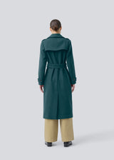 Classic, double-breasted wool coat with collar and notch lapels. ShayMD coat has a wide tiebelt at waist, shoulder straps, wide cuffs and open yoke. With lining and single back vent.