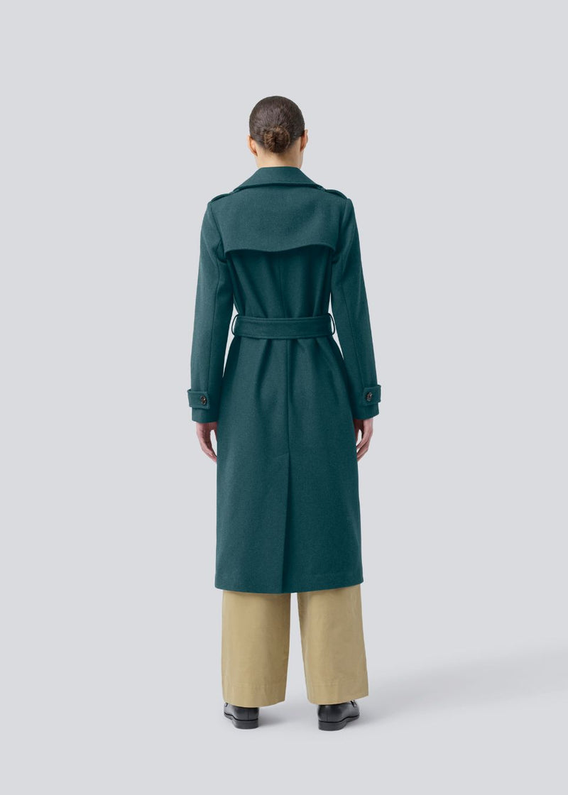Classic, double-breasted wool coat with collar and notch lapels. ShayMD coat has a wide tiebelt at waist, shoulder straps, wide cuffs and open yoke. With lining and single back vent.