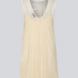 Sleeveless dress in a short length cut from a lace material. DionaMD dress has a round neck in front and a deep neckline in the back. The model is 177 cm and wears a size S/36.