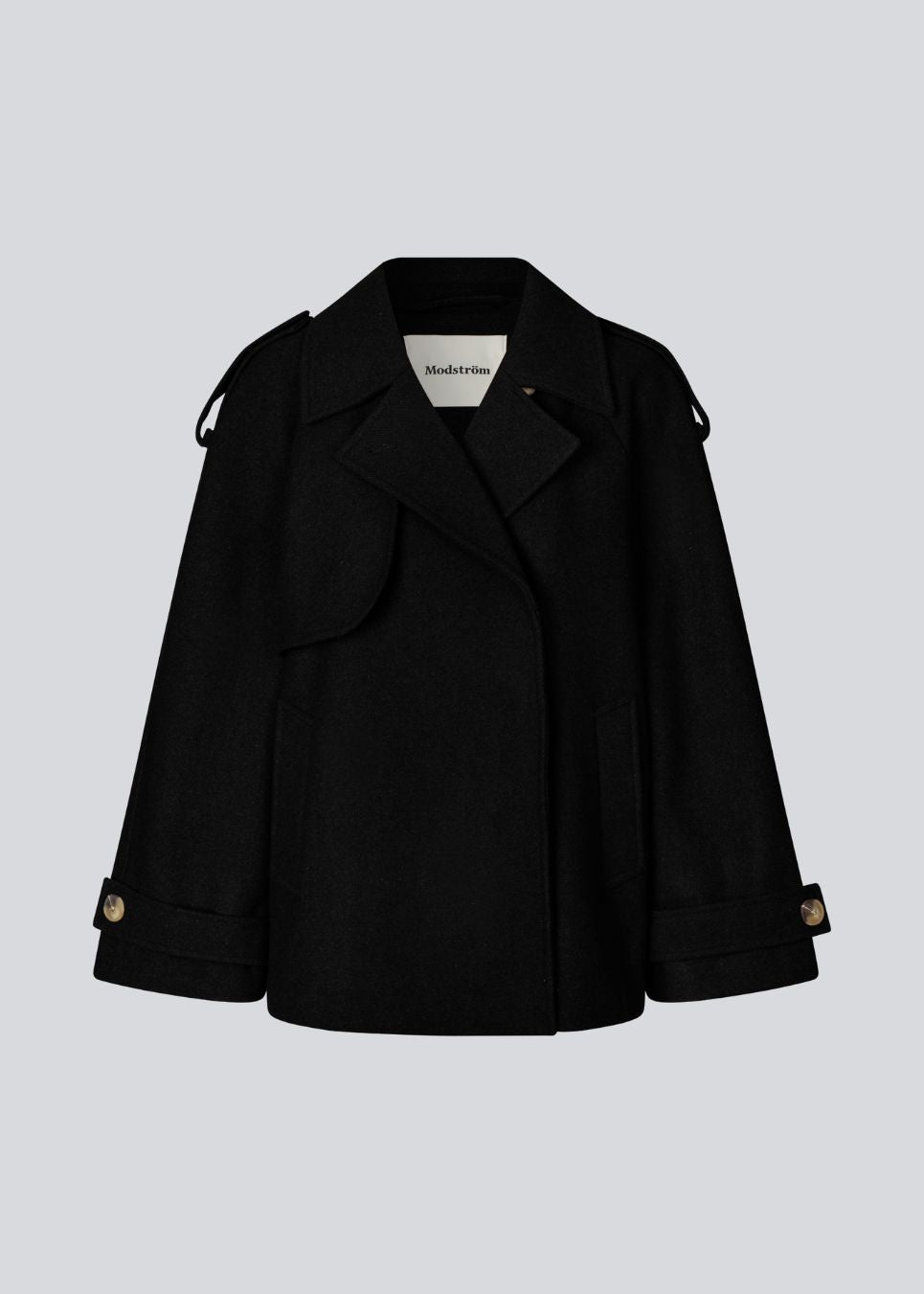 Cropped double-breasted wool coat with hidden buttons. EsmundMD jacket has classic coat details with raglan sleeves and an high yoke at the back. Lined. The model is 175 cm and wears a size S/36.