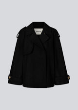 Cropped double-breasted wool coat with hidden buttons. EsmundMD jacket has classic coat details with raglan sleeves and an high yoke at the back. Lined. The model is 175 cm and wears a size S/36.