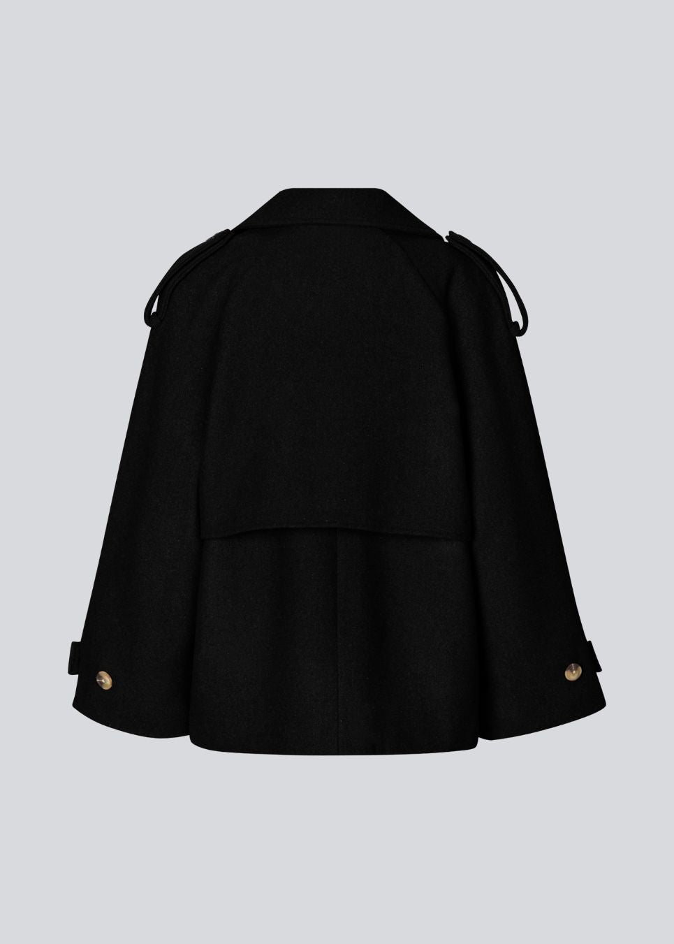 Cropped double-breasted wool coat with hidden buttons. EsmundMD jacket has classic coat details with raglan sleeves and an high yoke at the back. Lined. The model is 175 cm and wears a size S/36.