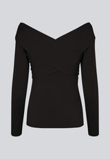 Long-sleeved top in black in a soft quality. GeorgiaMD wrap top has a slim silhouette and a slight off-shoulder effect with a draped wrap look at the top. The model is 175 cm and wears a size S/36.