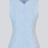 Tailored top without sleeves made from a structured material. HollisMD top has a high v-shaped neckline with a hidden zipper at the neck.