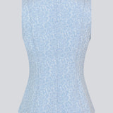 Tailored top without sleeves made from a structured material. HollisMD top has a high v-shaped neckline with a hidden zipper at the neck.