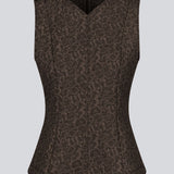 Brown tailored top without sleeves made from a structured material. HollisMD top has a high v-shaped neckline with a hidden zipper at the neck.&nbsp;