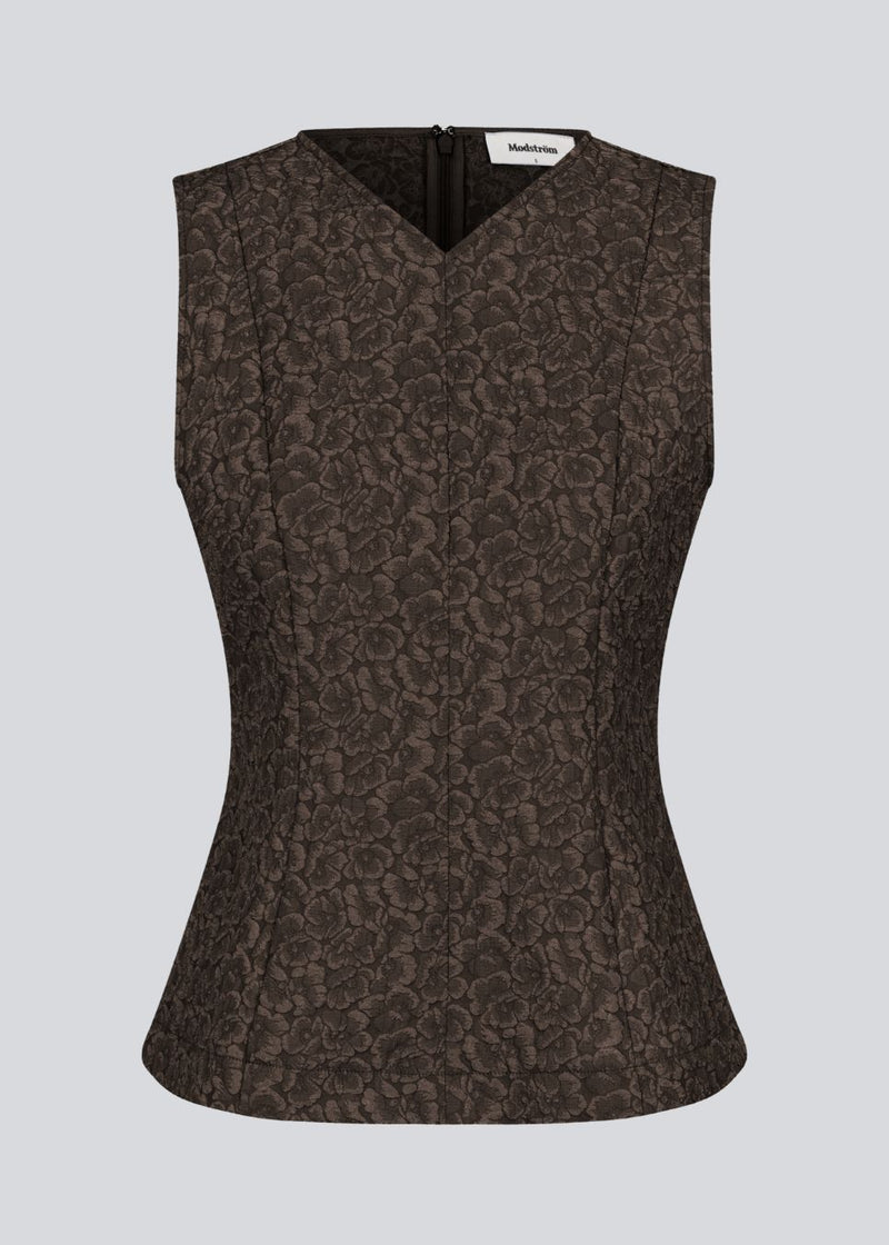 Brown tailored top without sleeves made from a structured material. HollisMD top has a high v-shaped neckline with a hidden zipper at the neck.&nbsp;