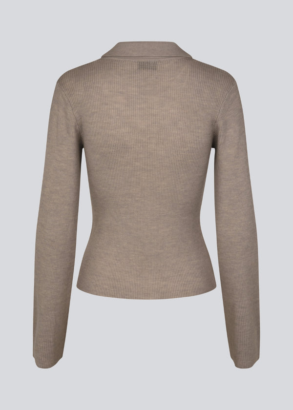 Fitted cardigan in brown made from a soft, rib-knitted wool. HirokiMD cardigan has a collar, buttons in front, and long sleeves with slit and buttons.&nbsp;