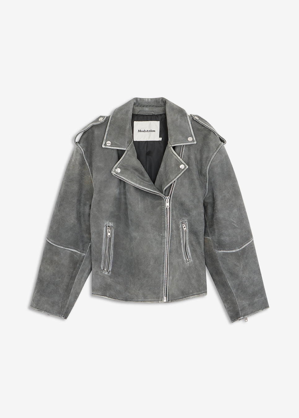 Grey leather jacket in soft lamb leather with bias zipper in front, lapels with push buttons, and long sleeves with zipper. The jacket is oversized. HullaMD jacket has bias front pockets with zip closure in front. Lined. The model is 175 cm and wears a size S/36.