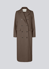 Classic, double-breasted wool coat with collar and notch lapels. JuniperMD coat has a relaxed fit, lining and a slit in the back.