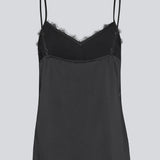 Satin top with a soft drape in black with black lace. TenjaMD top is detailed with lacing on the front and has thin straps.