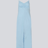Maxi dress in baby blue with thin straps and an elastic gathering at the chest. TrentonMD print dress has a slit in the front and an invisible zipper at the back.<br>