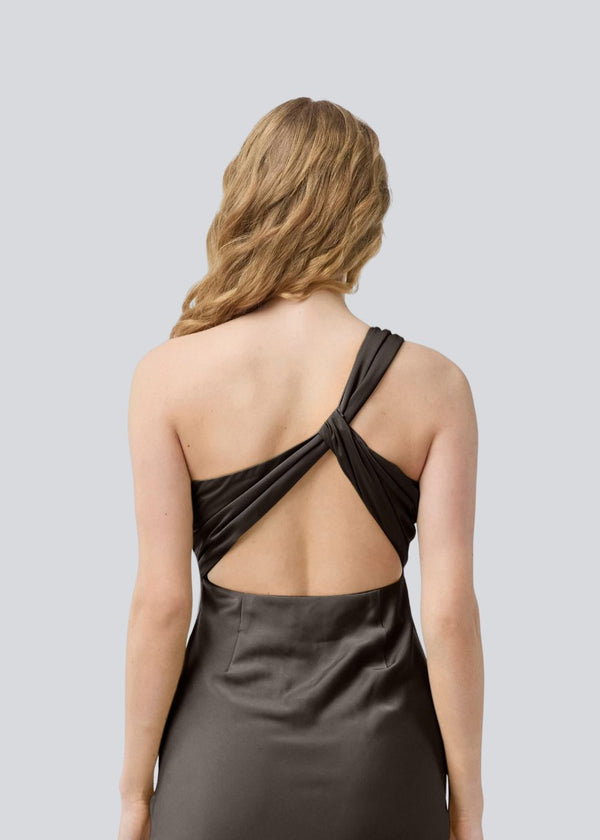 Dark brown maxi one-shoulder dress in satin. NarcissaMD dress has an open back with beautiful details and an invisible zipper on the side.
