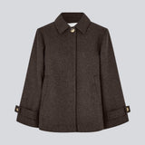 Classic short jacket in a wool mix. Ofiamd jacket has a relaxed fit, hidden button closure and collar. The model is 175 cm and wears a size s/36.