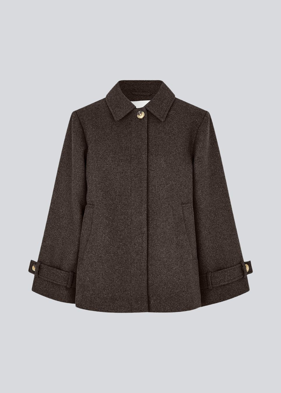 Classic short jacket in a wool mix. Ofiamd jacket has a relaxed fit, hidden button closure and collar. The model is 175 cm and wears a size s/36.