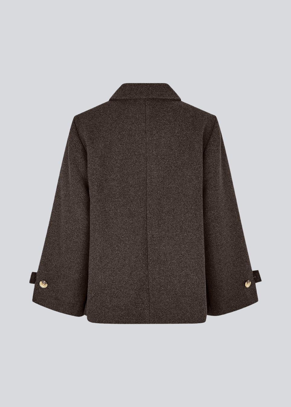 Classic short jacket in a wool mix. Ofiamd jacket has a relaxed fit, hidden button closure and collar. The model is 175 cm and wears a size s/36.