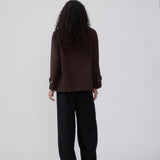 Classic short jacket in a wool mix. Ofiamd jacket has a relaxed fit, hidden button closure and collar. The model is 175 cm and wears a size s/36.
