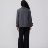 Classic short jacket in a wool mix. Ofiamd jacket has a relaxed fit, hidden button closure and collar. The model is 175 cm and wears a size s/36.