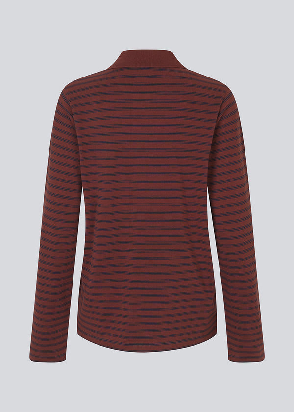 Navy striped polo in burgundy/dark red in 100% cotton pique with an embroidered logo. NobuMD LS polo has long sleeves and a placket with 4 buttons.&nbsp;