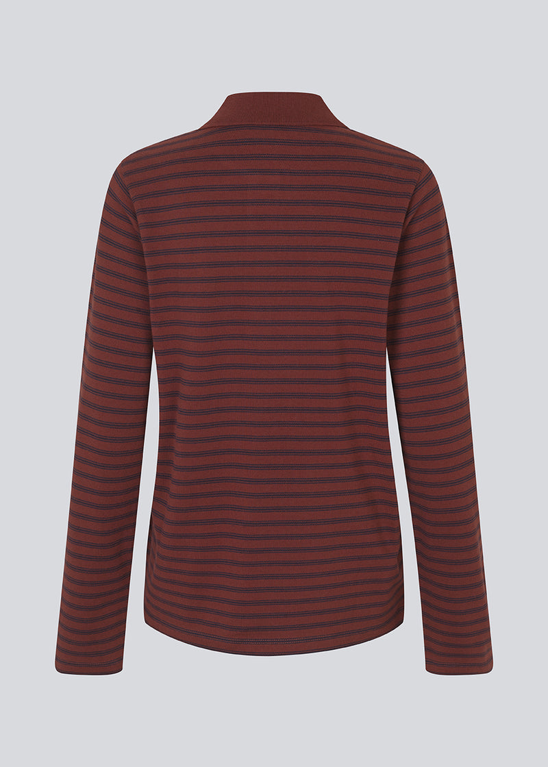 Navy striped polo in burgundy/dark red in 100% cotton pique with an embroidered logo. NobuMD LS polo has long sleeves and a placket with 4 buttons.&nbsp;