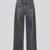 Black jeans with wide legs in cotton denim. IsoldeMD pants has a high waist, front and back pockets, and a tie band at the waist. The model is 175 cm and wears a size S/36.