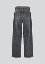 Black jeans with wide legs in cotton denim. IsoldeMD pants has a high waist, front and back pockets, and a tie band at the waist. The model is 175 cm and wears a size S/36.