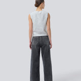 Black jeans with wide legs in cotton denim. IsoldeMD pants has a high waist, front and back pockets, and a tie band at the waist. The model is 175 cm and wears a size S/36.