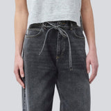Black jeans with wide legs in cotton denim. IsoldeMD pants has a high waist, front and back pockets, and a tie band at the waist. The model is 175 cm and wears a size S/36.