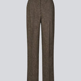 Brown wool trousers with wide legs. The Rockymd pants have a high waist, front pleats, and side pockets – a structured, classic pants with a timeless feel.