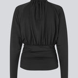 Elegant black blouse featuring a high neckline and long sleeves. Designed with delicate gathered details at the bust and waist to create a flattering silhouette. A subtle button closure at the back of the neck adds a refined and feminine touch. The stretchy fabric ensures a comfortable fit, while the draped design offers timeless elegance. Perfect for both everyday wear and special occasions.