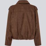 Short brown jacket made from a soft, suede-like material. Features a classic shirt collar, hidden zip and button closure at the front, and practical front pockets. The structured shoulders with strap details and the slightly elasticated hem add a modern, tailored touch. A versatile and stylish piece, perfect for transitional weather and everyday wear.