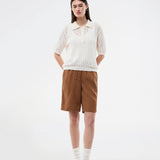 Short-sleeve polo in a sheer knit pattern. The AgnesMD SS Polo features classic details such as a collar, buttons, and ribbed edges. A modern and feminine polo that combines lightness with timeless design.