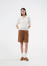 Short-sleeve polo in a sheer knit pattern. The AgnesMD SS Polo features classic details such as a collar, buttons, and ribbed edges. A modern and feminine polo that combines lightness with timeless design.