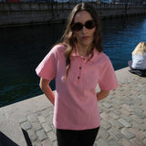 Short-sleeved polo in pink in 100% cotton pique with an embroidered logo. NobuMD LS polo has a placket with 3 buttons.