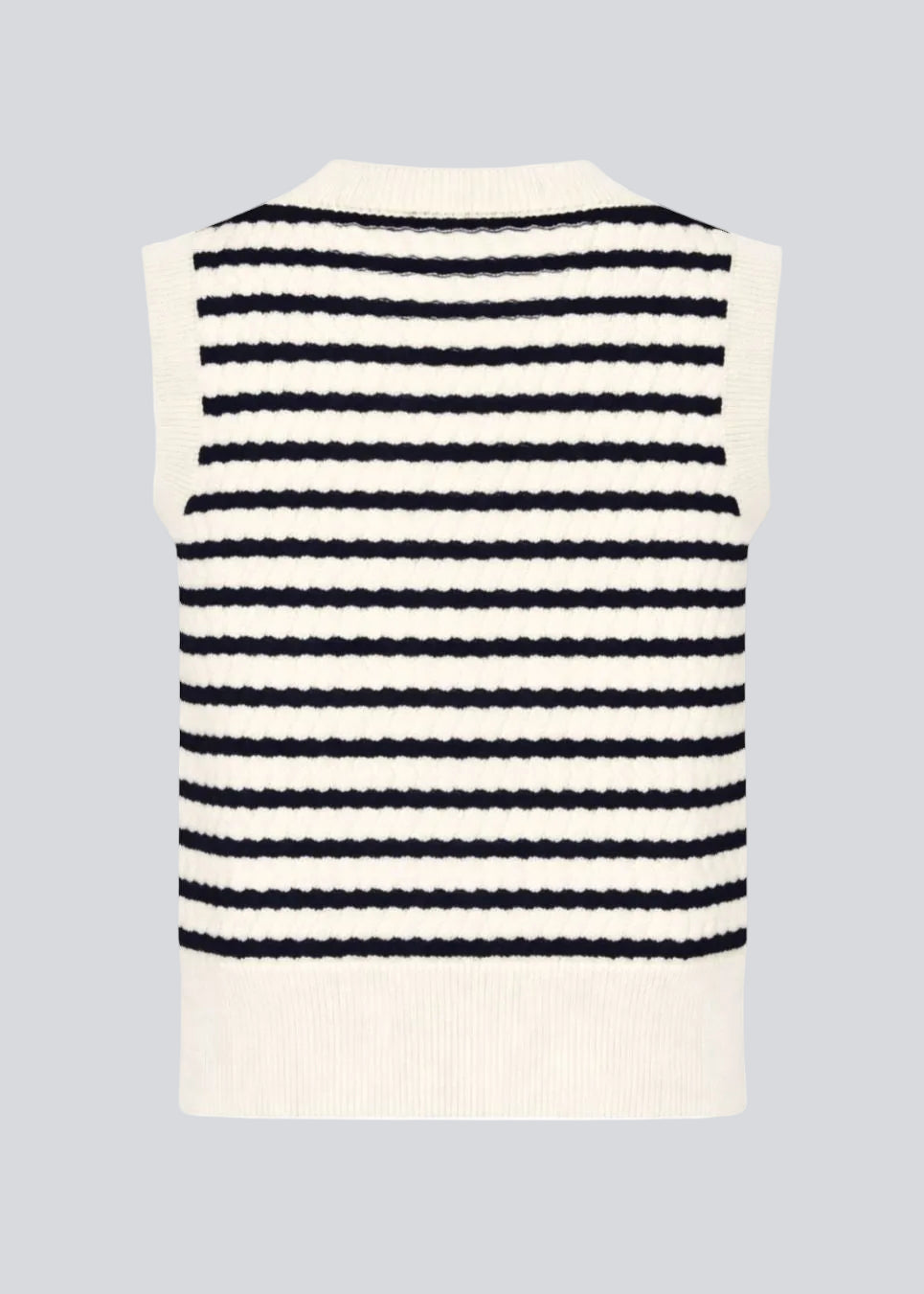 Knitted vest in navy and white with a round neckline and front button closure. The UlvaMD Stripe Top features a classic striped pattern and wide ribbed trims for a flattering fit. Made from 100% organic cotton – perfect for layered styling.&nbsp;