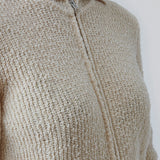 Relaxed cardigan in cotton with collar and zipper, for styling open or closed. Omen cardigan has long sleeves and a wide ribknitted waist. The model is 173 cm and wears a size S/36