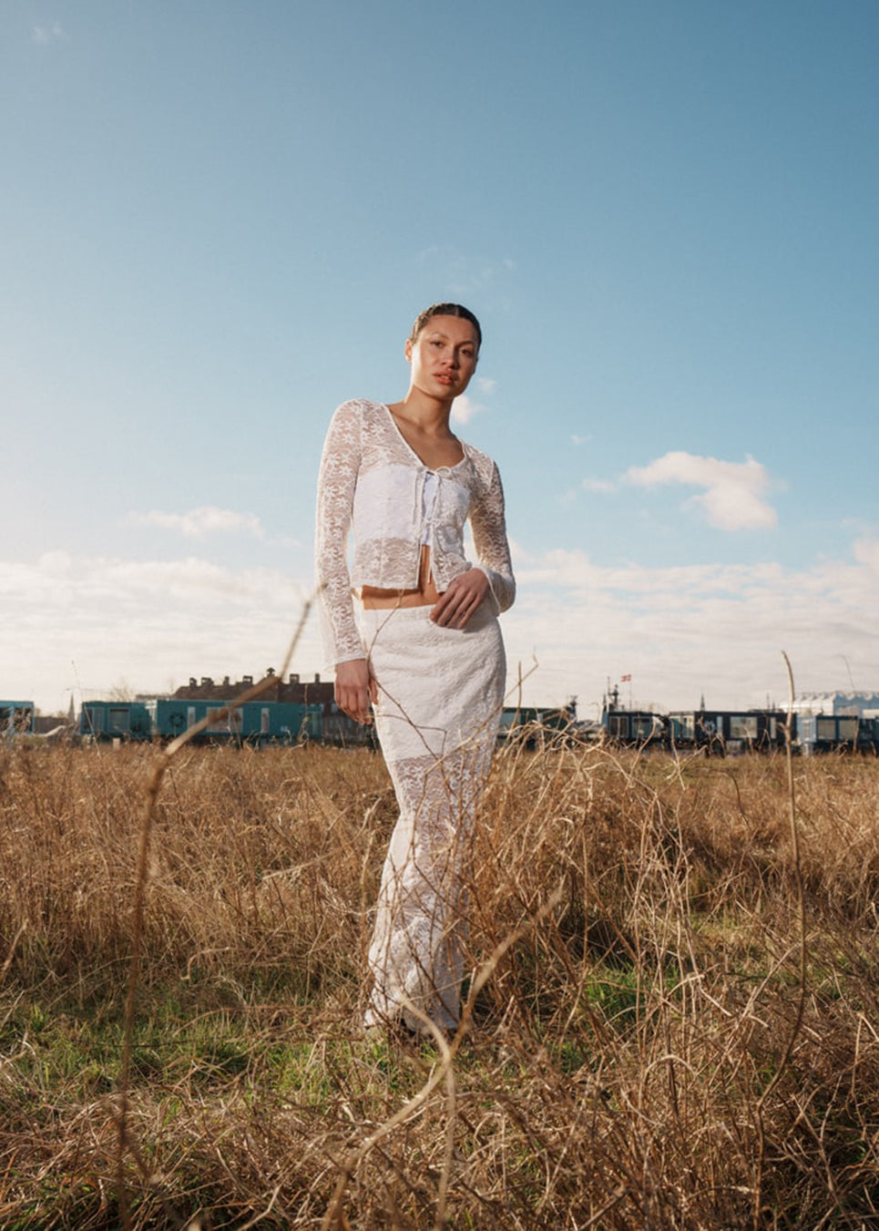 Maxi skirt in a white see-through lace material. TildeMD skirt has lining and an elastic waistband.<br>